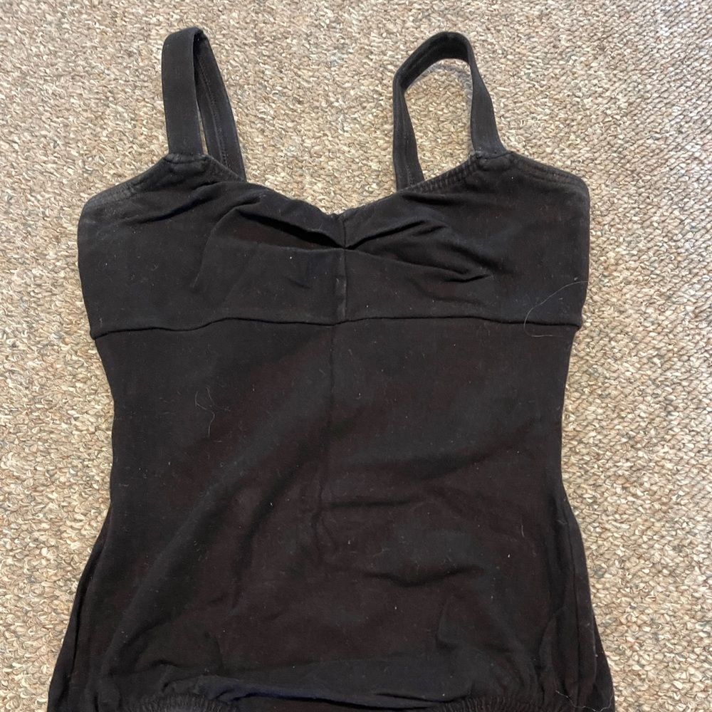 Classic black tank body suit with sinched sweet heart neck line.